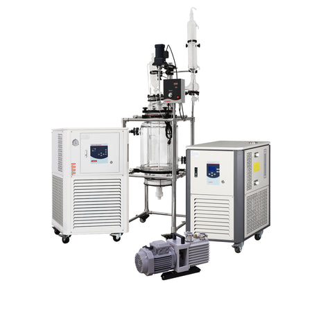 Laboratory equipment with a glass reactor and control panels on a white background